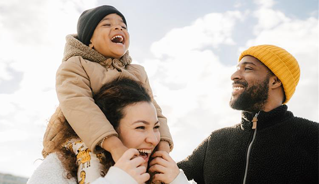 a group of coworkers sitting around a conference table having a meeting