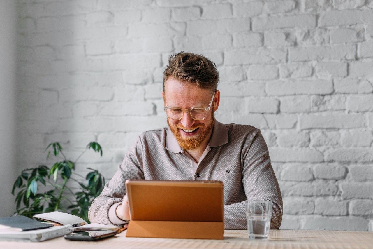 Man at Work Using Digital Tablet