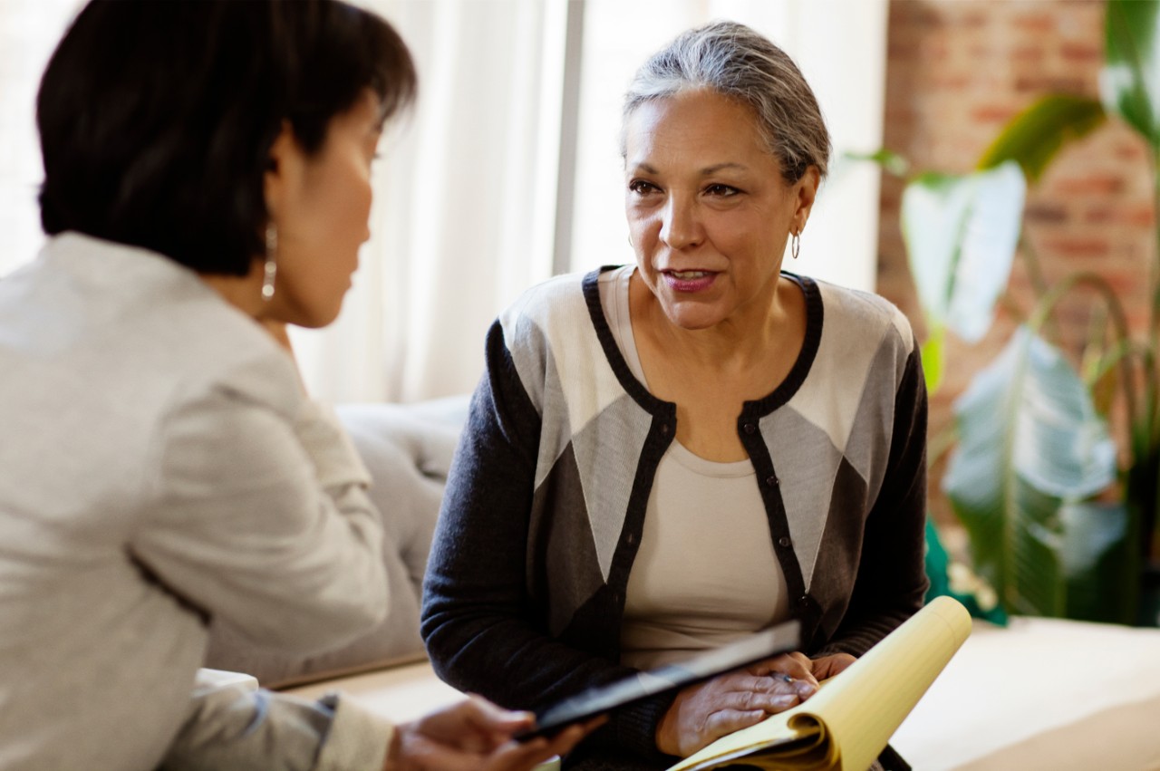 Man staring at wall with charts and graphs