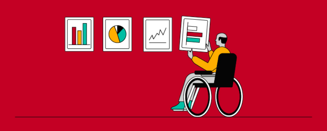 Man in wheelchair fixing pictures on wall