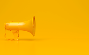yellow bullhorn on a yellow background