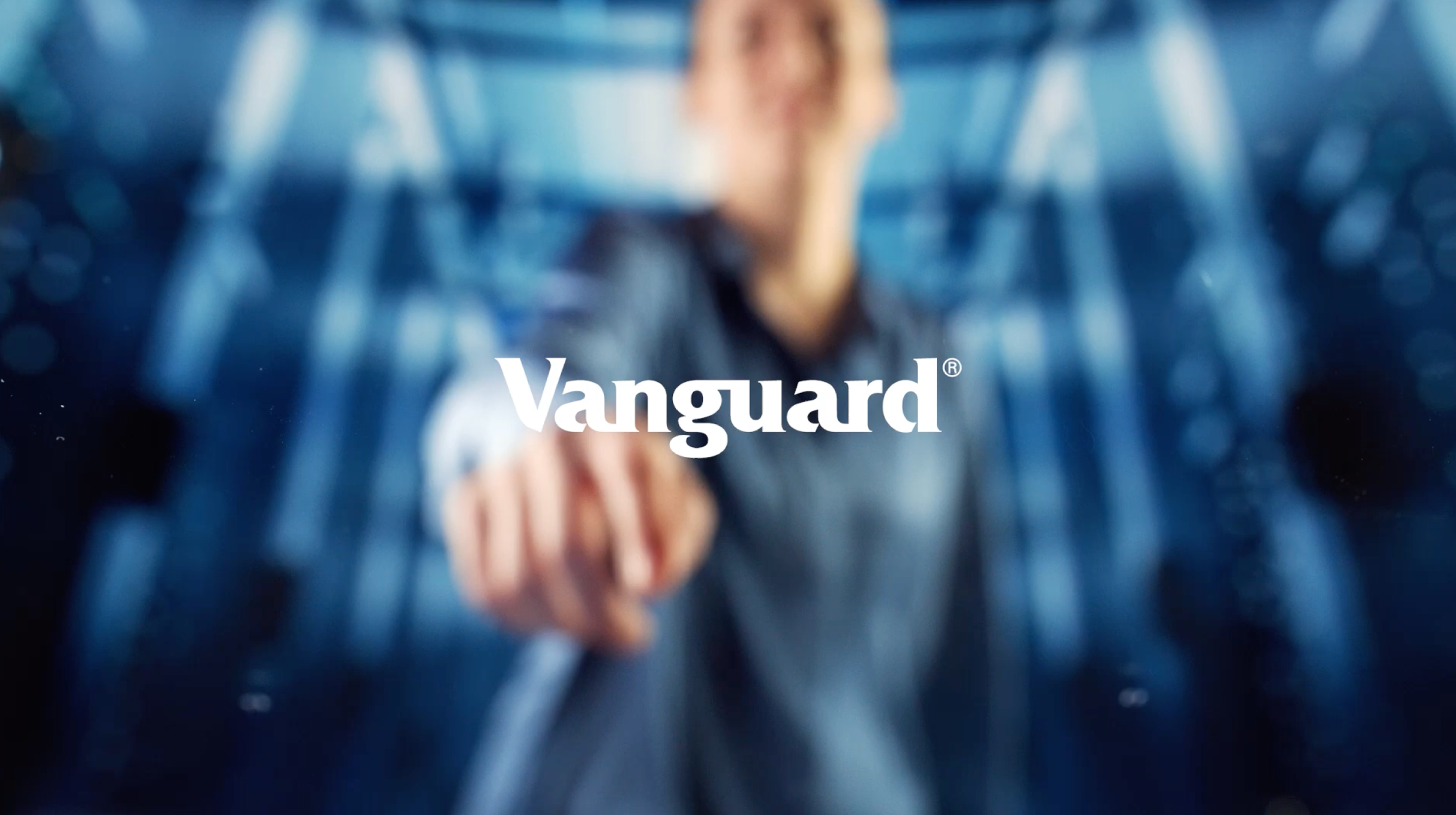 Vanguard written in white font on a tech background