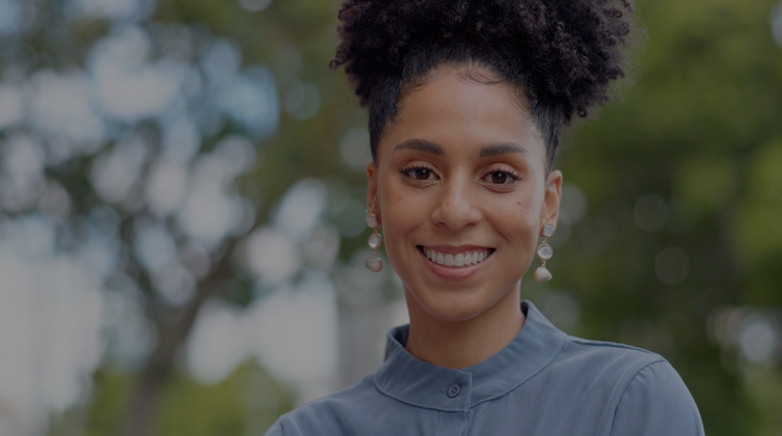 a smiling women staring a head